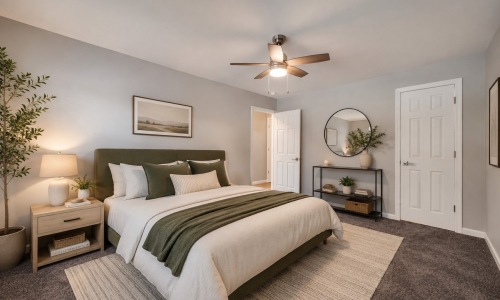 a bedroom with a bed and two nightstands