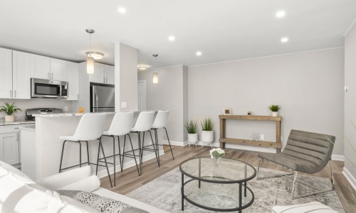kitchen with ample counter-space, modern appliances and bright lighting
